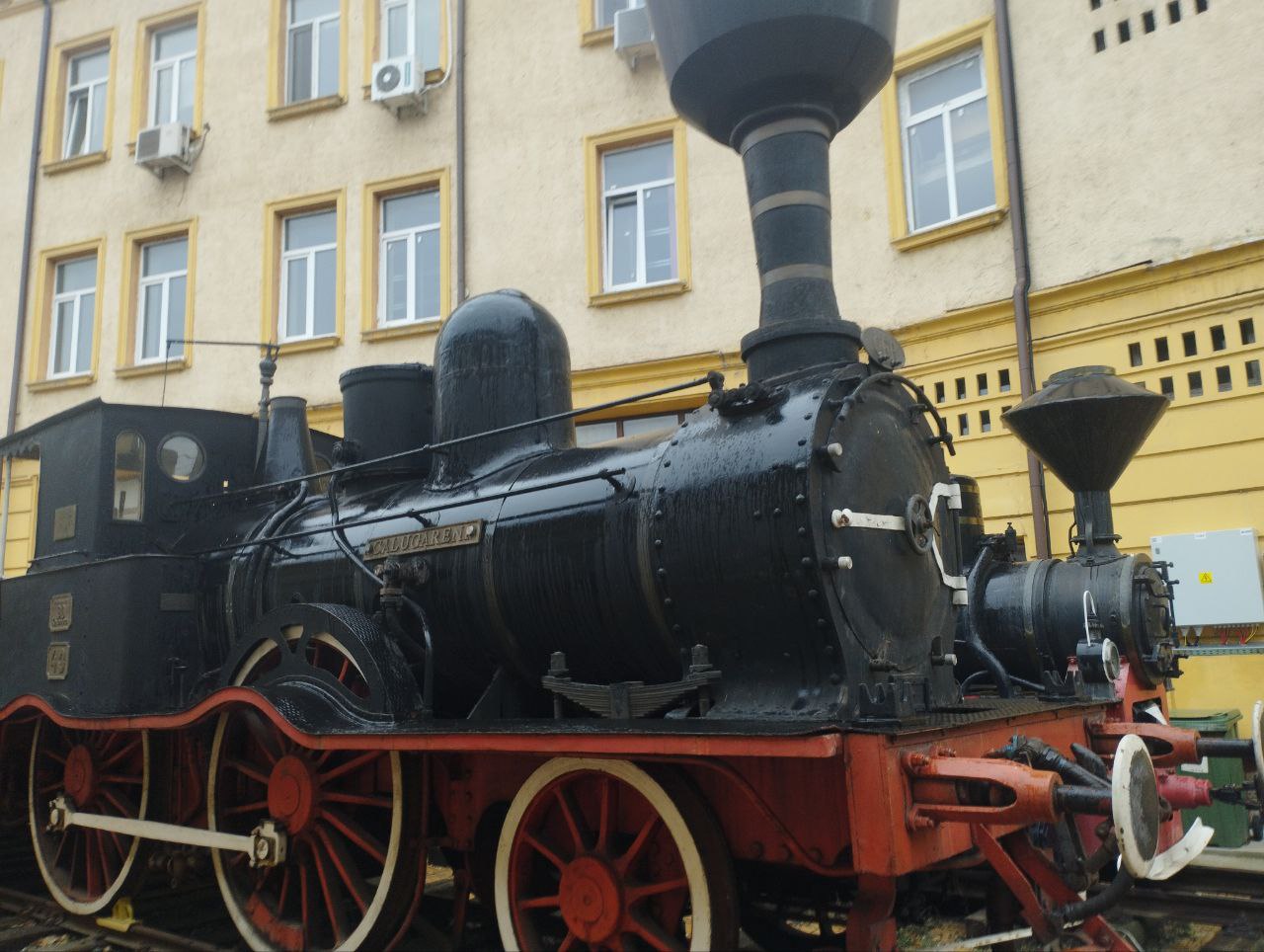 A huge steam locomotive parked outside of the CFR museum